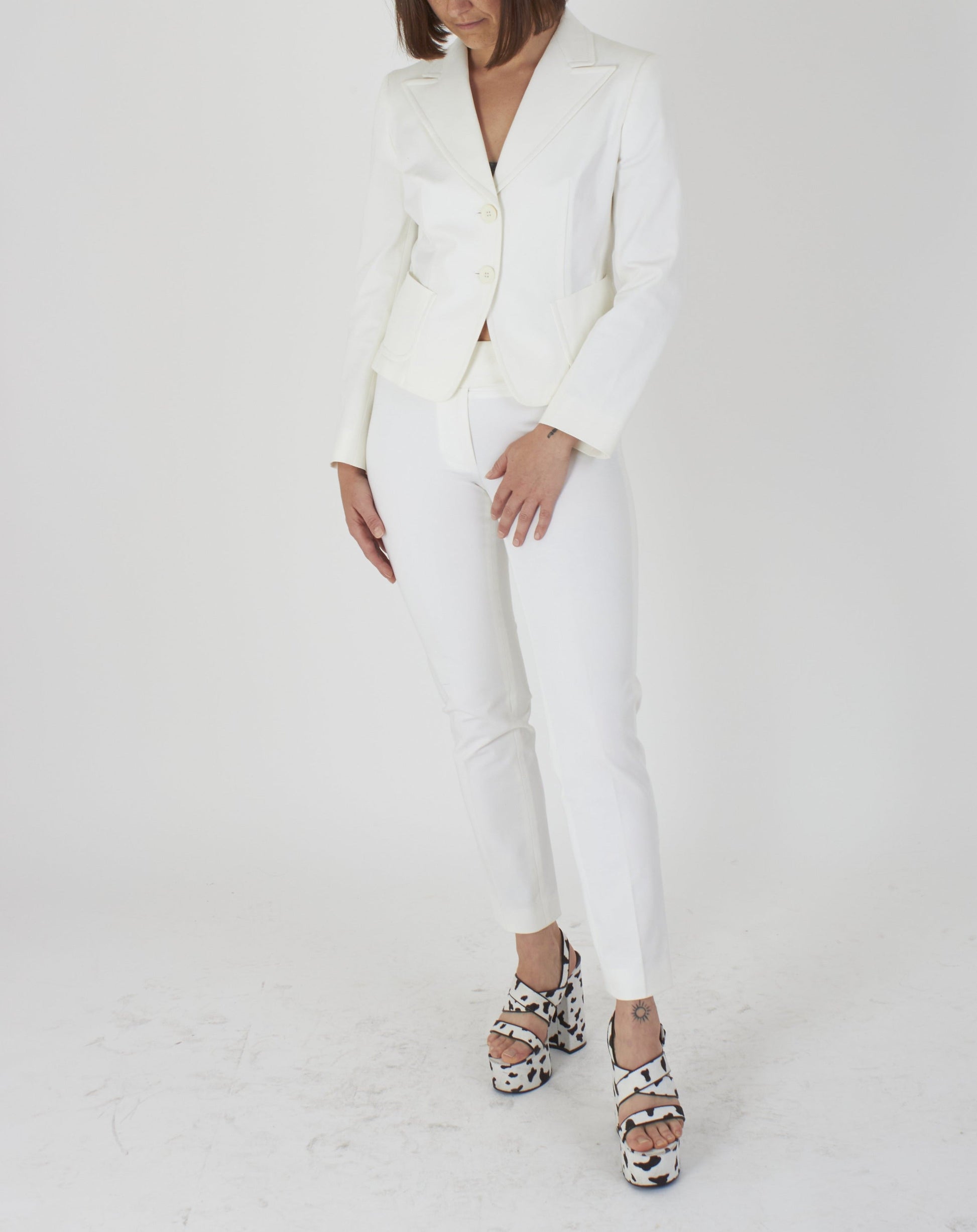Stella McCartney Paris Ready to Wear Spring Summer White trouser suit with  silk wide legged trousers and buttoned jacket Stock Photo  Alamy